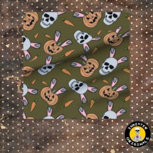 Olive green fabric with skulls wearing bunny ears, carved jack-o-lanterns and scattered carrots in a tossed repeat pattern
