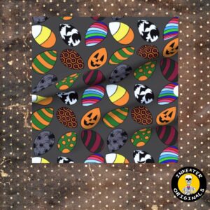 Dark gray fabric with candy corn shaped Easter eggs featuring horror icons including jack-o-lanterns, skulls, spiders and Freddy Krueger stripes