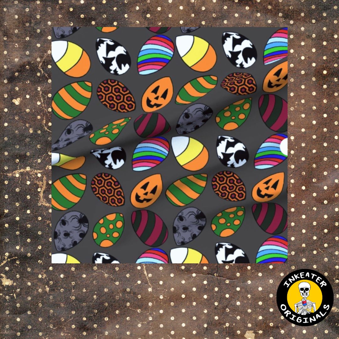 Dark gray fabric with candy corn shaped Easter eggs featuring horror icons including jack-o-lanterns, skulls, spiders and Freddy Krueger stripes
