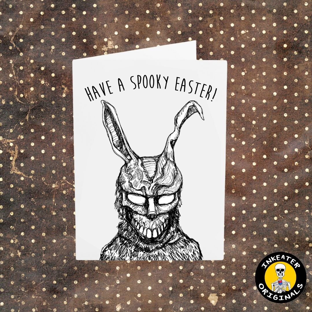 Greeting card with a hand-drawn black and white illustration å a character resembling 'Frank the Rabbit' from Donnie Darko, with the text 'HAVE A SPOOKY EASTER!' on the front, set against a brown background with white dots.