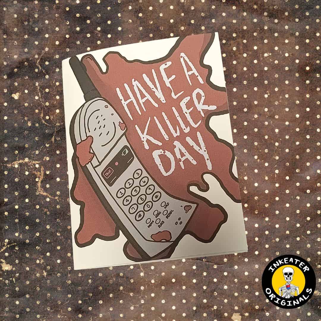 Horror-inspired Father's Day greeting card featuring a ringing cellphone in a pool of blood with the text "Have a Killer Father's Day."